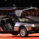 A photo of a DeLorean sports car on a red carpet.